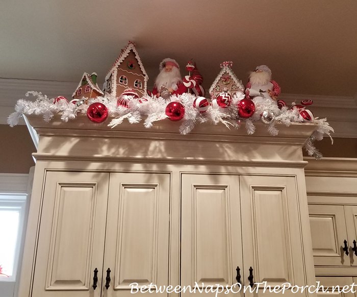 Christmas decor on top of kitchen cabinets