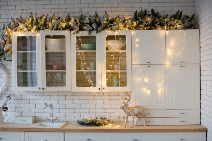 Christmas decor on top of kitchen cabinets